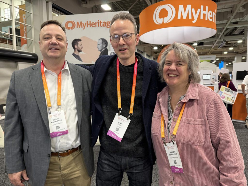 Jonny with Geoff and Marian of Legacy Family Tree Webinars in the RootsTech 2026 Expo Hall